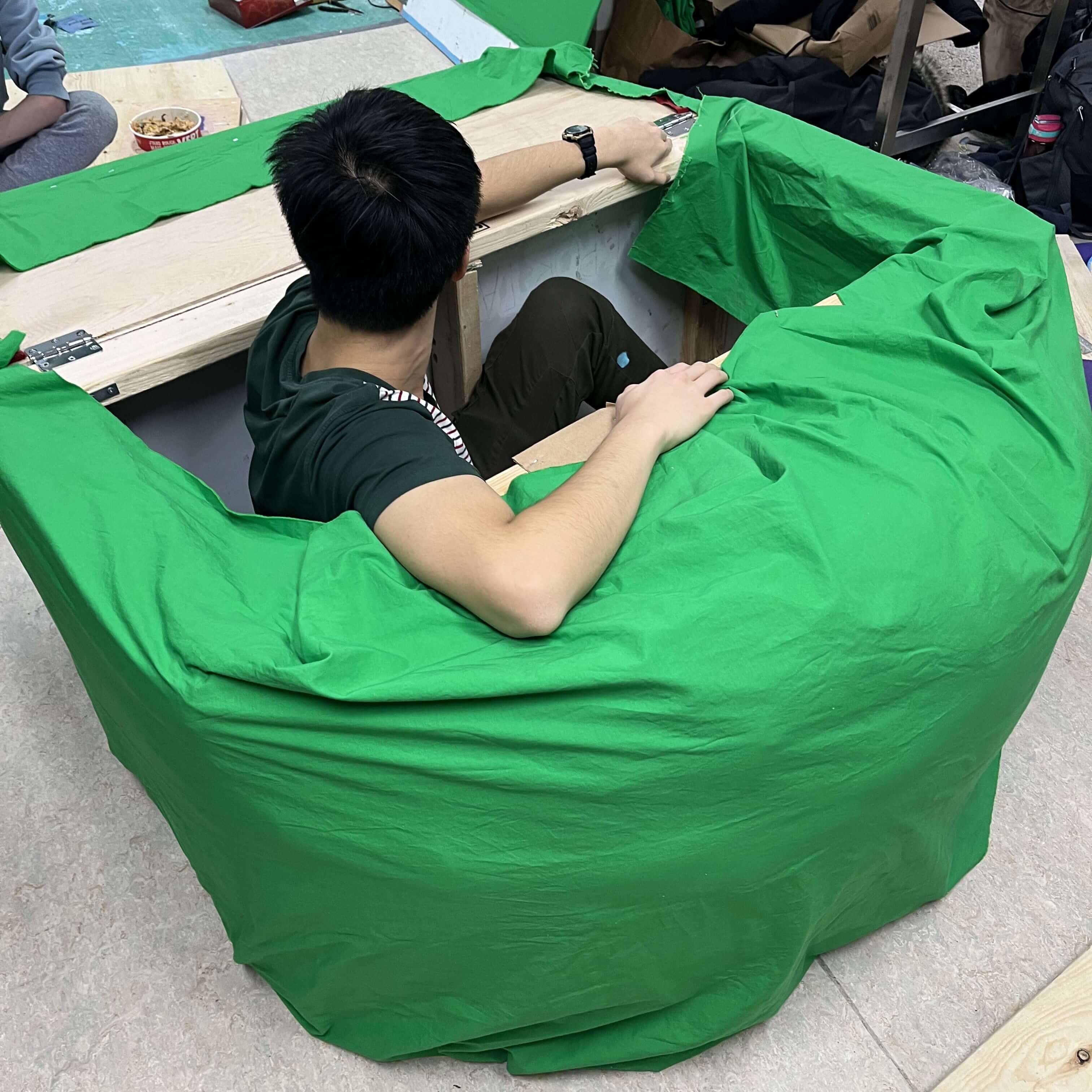 A team member in the kiosk storage box.